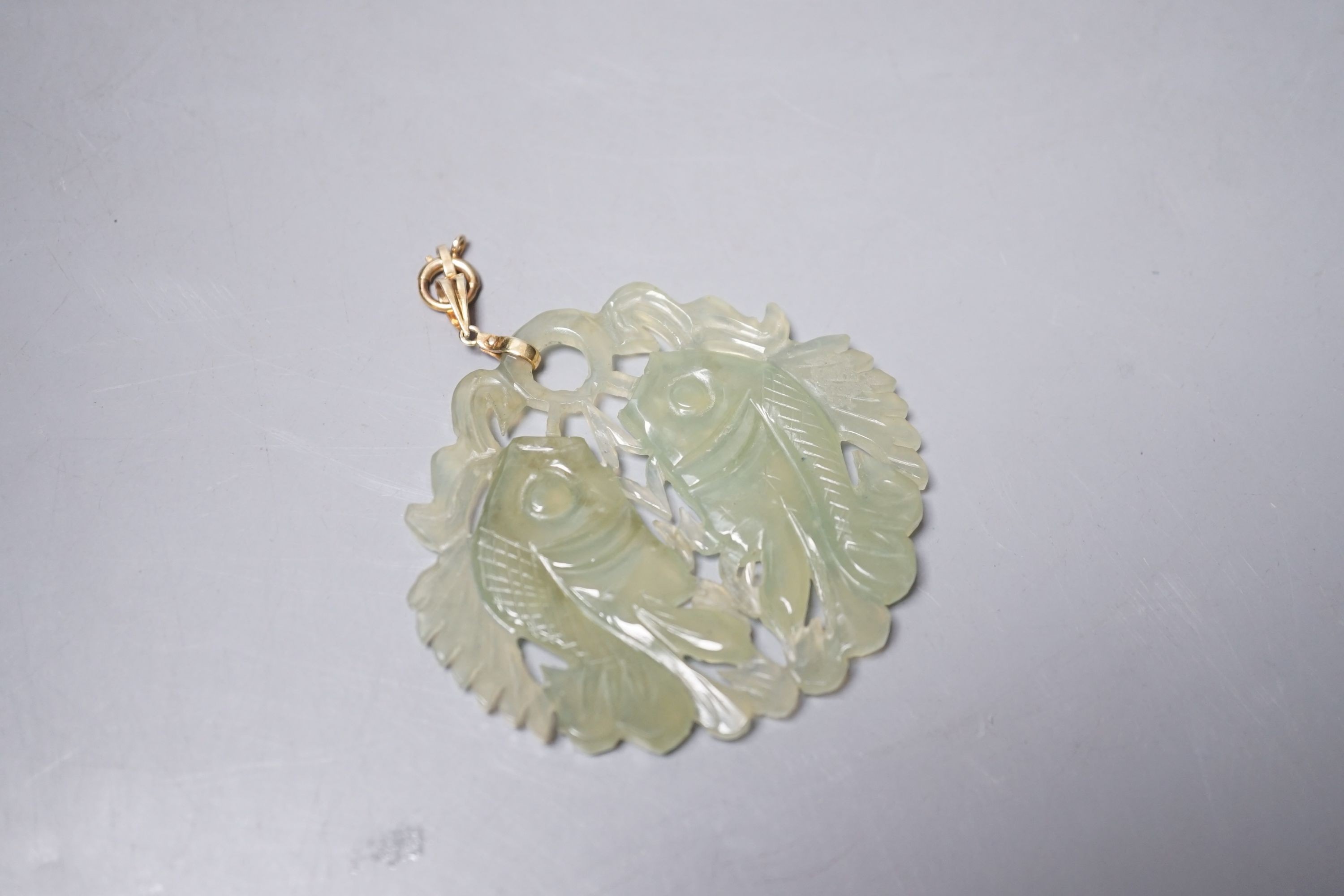 A Chinese carved bowenite jade ‘fish’ pendant